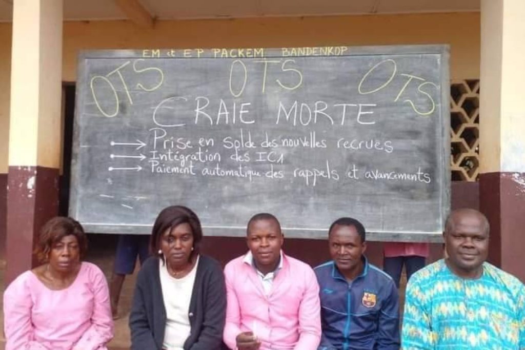 teacher protest with written demands on the black board 